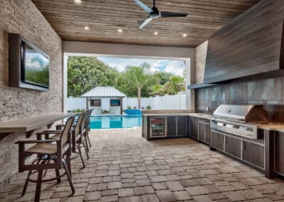 outdoor kitchen with grill area and sunken bar florida